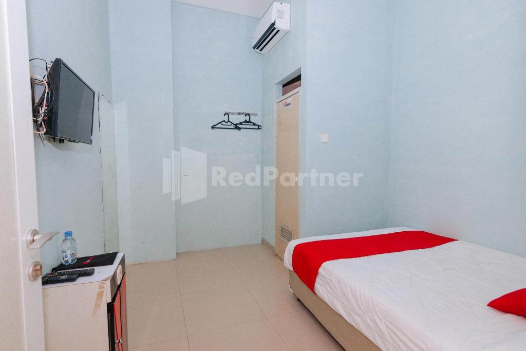 TV a/nebo společenská místnost v ubytování OYO 94494 Krekot Residence Pasar Baru COO Property