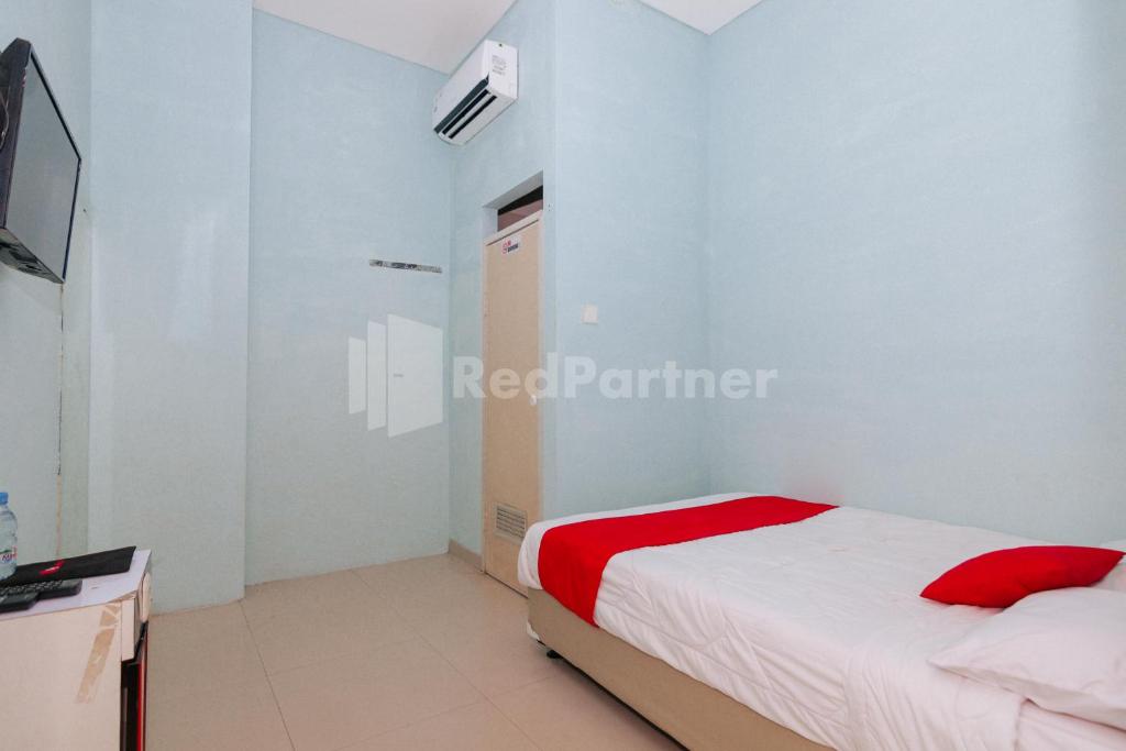 TV a/nebo společenská místnost v ubytování OYO 94494 Krekot Residence Pasar Baru COO Property