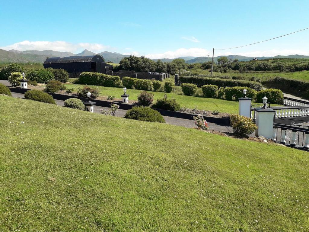 a view of a garden from the top of a hill at Room in Apartment - 1 Bedroom In A Homely Home With A Lovely Farm 