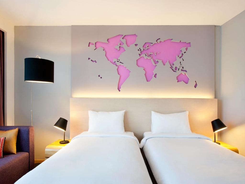 Postel nebo postele na pokoji v ubytování Ibis Styles Jakarta Airport