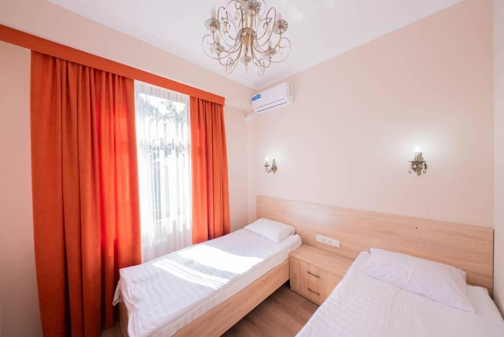 מיטה או מיטות בחדר ב-Kaganat Hostel