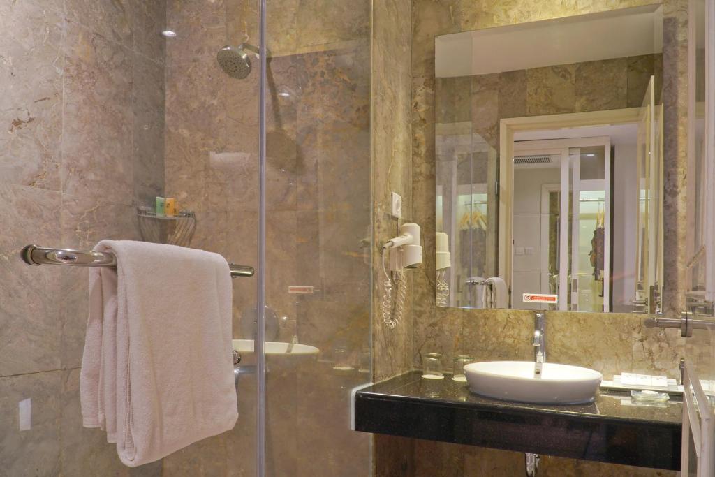 Koupelna v ubytování Swiss-Belhotel Lampung