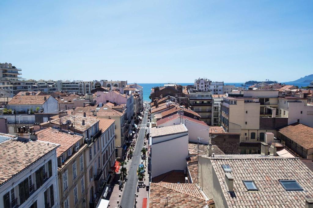 a city street with buildings and buildings at BW Premier Collection Mondial in Cannes