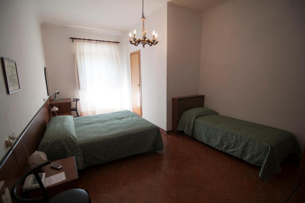 Postel nebo postele na pokoji v ubytování Tre Fiumi
