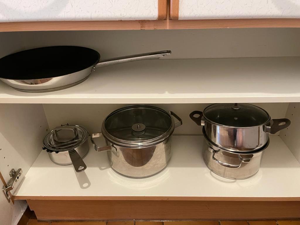 two pots and pans sitting on a kitchen stove at Zentrum & Schöne Terasse in Graz
