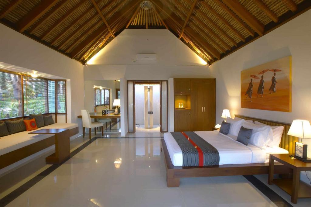 Postel nebo postele na pokoji v ubytování Siddhartha Oceanfront Resort & Spa Bali