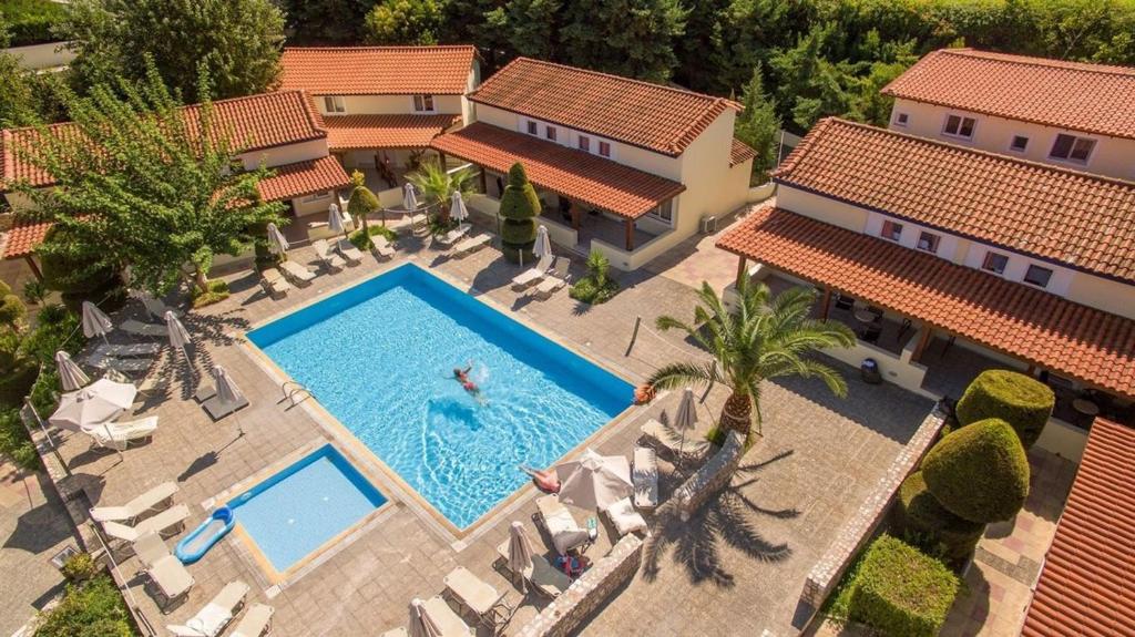 an overhead view of a swimming pool in front of a house at Aegean View Aqua Resort in Psalidi