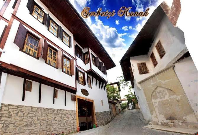 a large white building with a street in front of it at Şerbetçi Garden Konak in Safranbolu