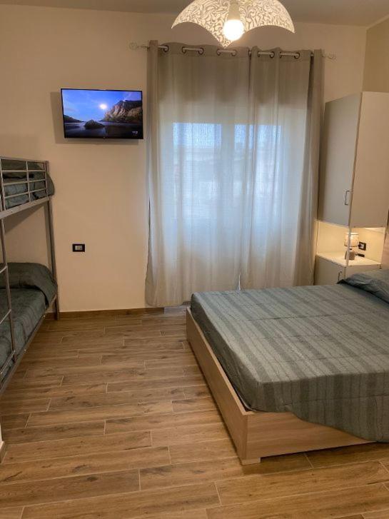 Łóżko lub łóżka w pokoju w obiekcie Antica Dogana Apartments