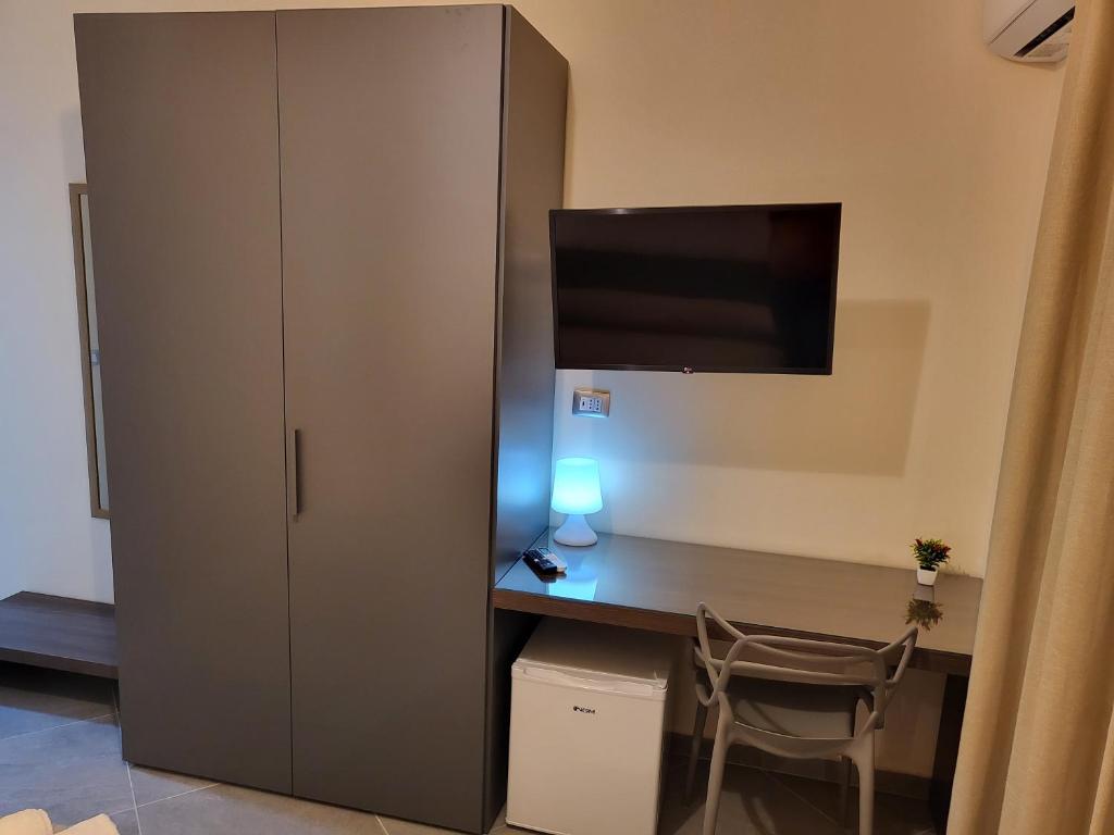 TV a/nebo společenská místnost v ubytování Casa dello stretto
