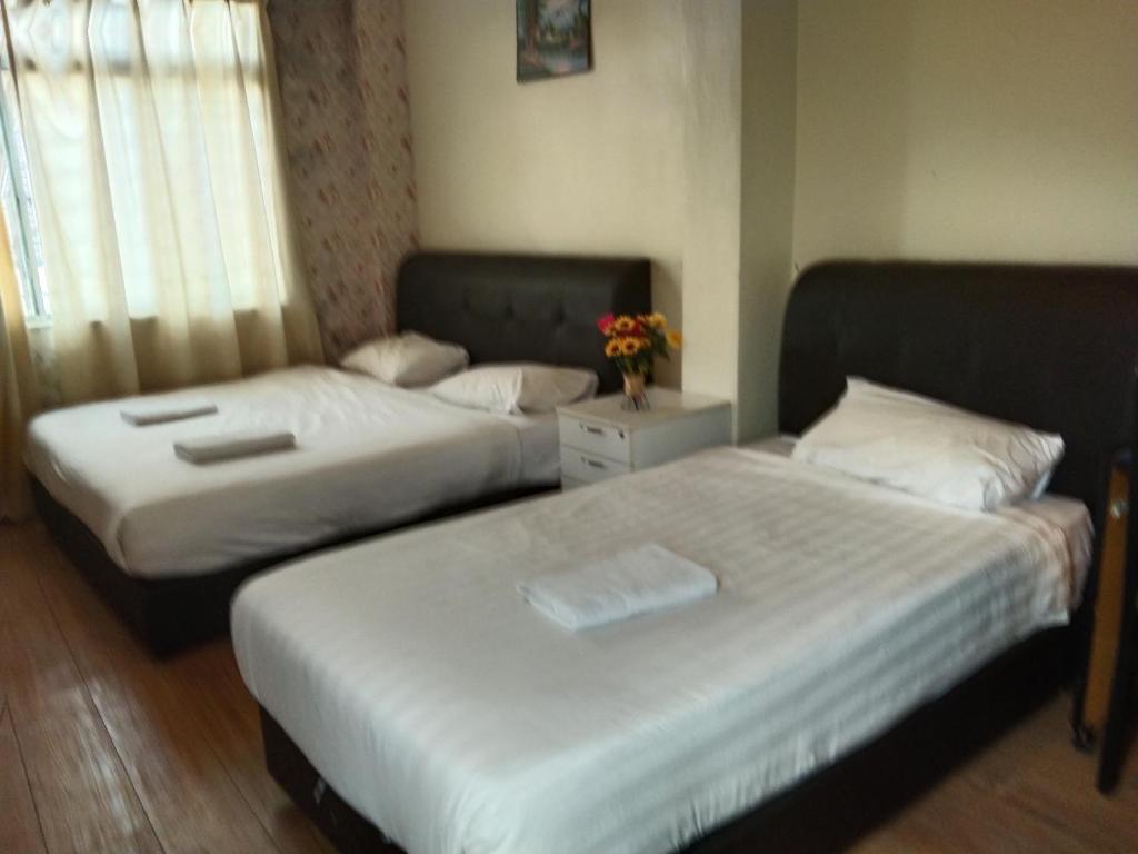 Postel nebo postele na pokoji v ubytování JAM Hotel Kota Warisan Sepang @ ERL Salak Tinggi, KLIA 1-2 & F1