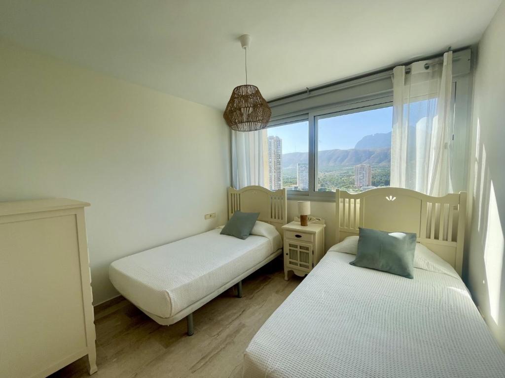 Posteľ alebo postele v izbe v ubytovaní Mirador Poniente Beach