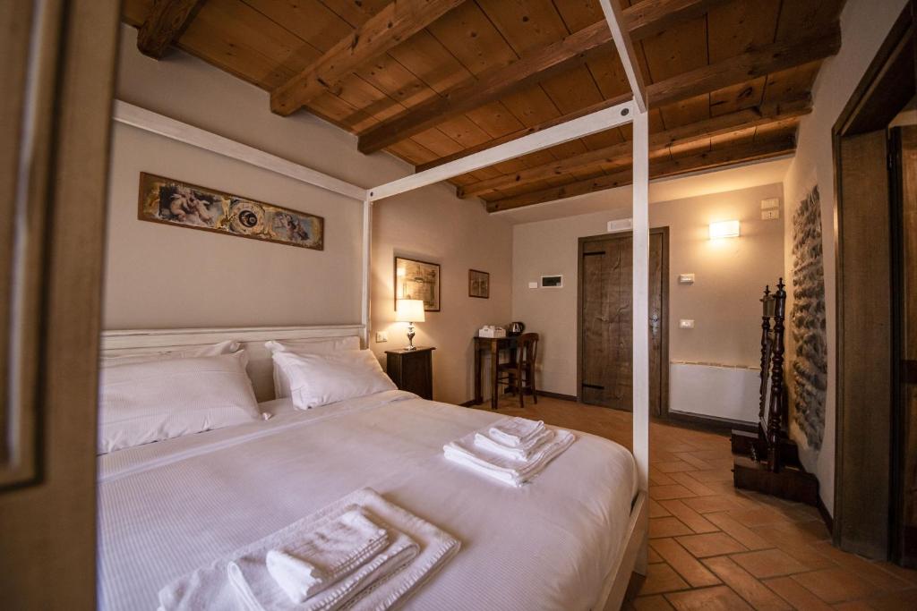 Postel nebo postele na pokoji v ubytování Villa dei Mulini