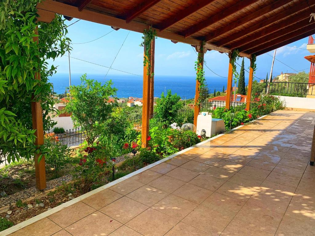 a patio with a view of the ocean at house with sea and mountain view in Rozená