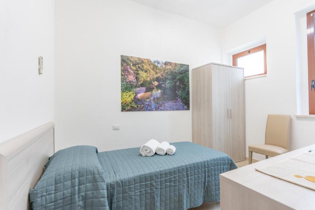 Postel nebo postele na pokoji v ubytování Hotel dei Tacchi