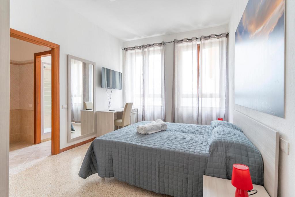 Postel nebo postele na pokoji v ubytování Hotel dei Tacchi
