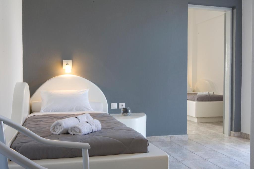 Postel nebo postele na pokoji v ubytování Philippion Boutique Hotel
