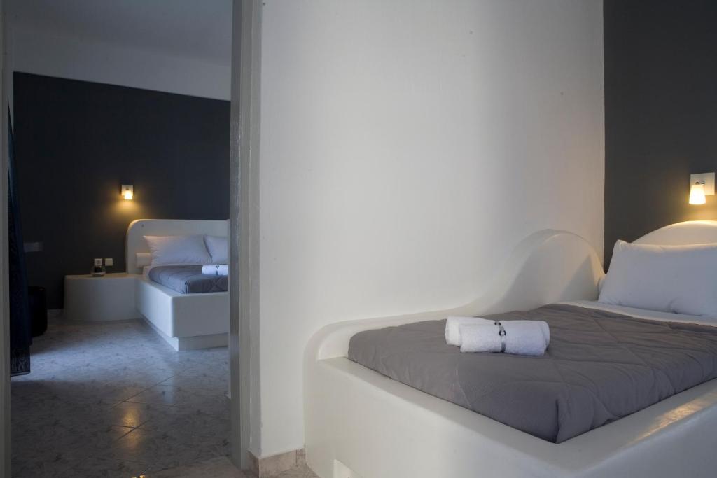 Postel nebo postele na pokoji v ubytování Philippion Boutique Hotel