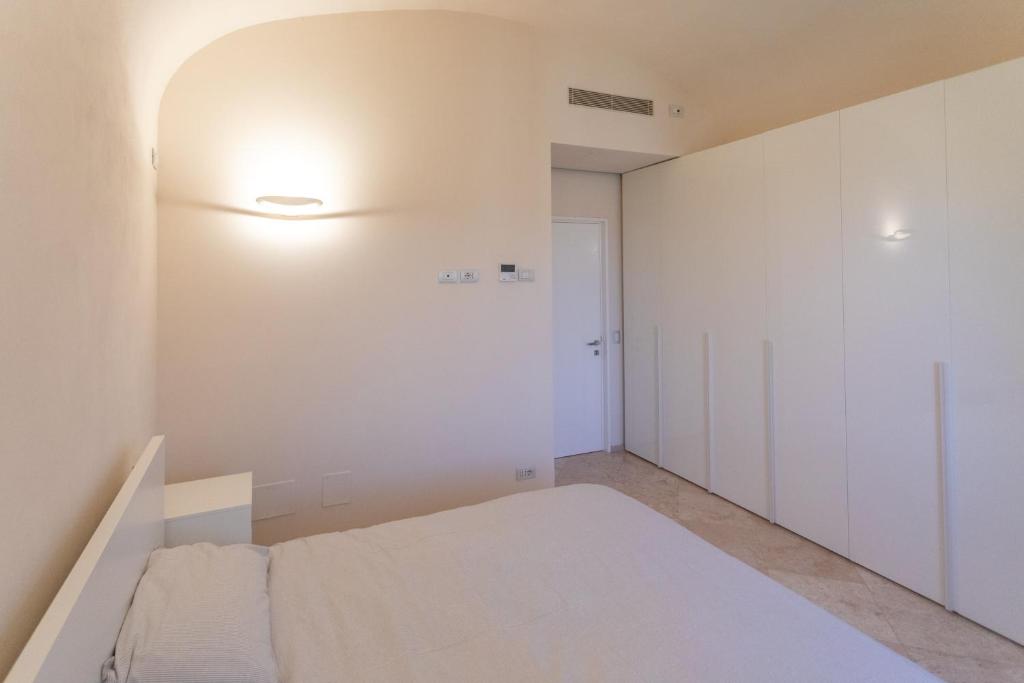 Posteľ alebo postele v izbe v ubytovaní GoldenTuscany Apartment