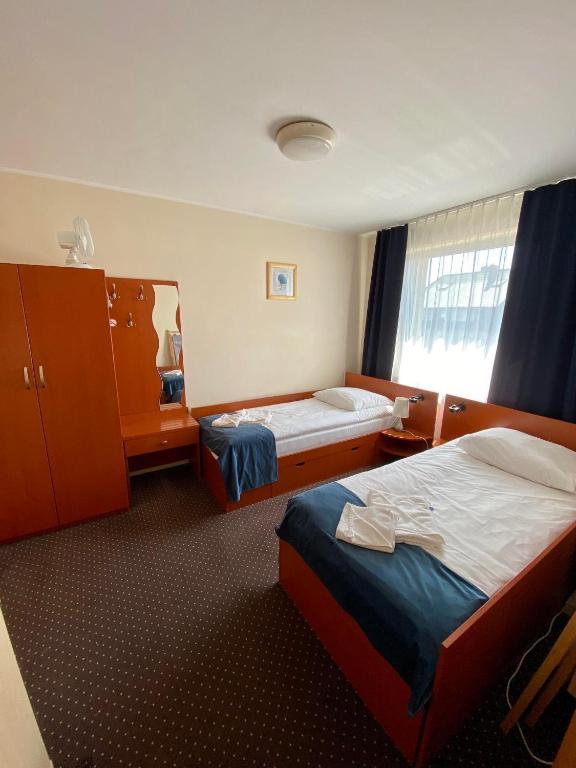 Postel nebo postele na pokoji v ubytování Villa Dominik
