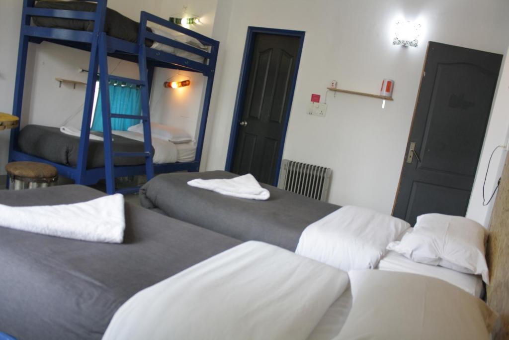 Postel nebo postele na pokoji v ubytování Bed & Chai Guesthouse