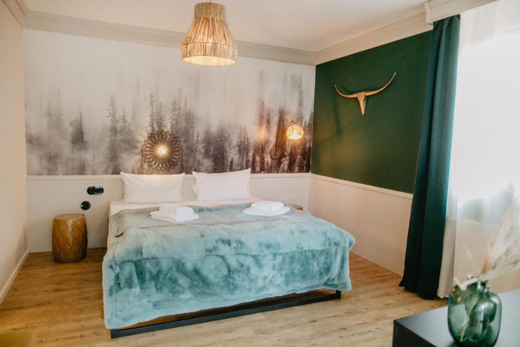 Postel nebo postele na pokoji v ubytování Peak Hotel & Event