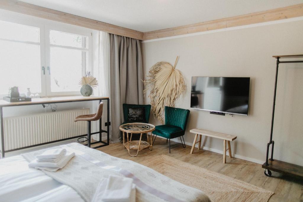 Postel nebo postele na pokoji v ubytování Peak Hotel & Event