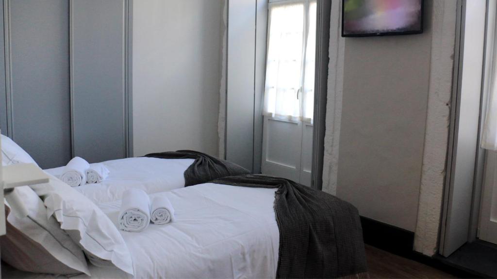Postel nebo postele na pokoji v ubytování Aliança café & hostel