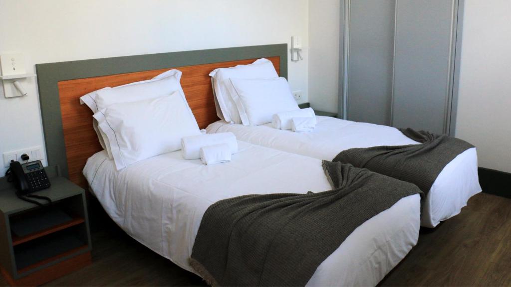 Postel nebo postele na pokoji v ubytování Aliança café & hostel
