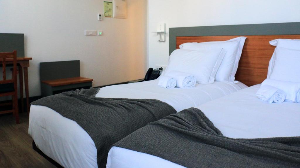Postel nebo postele na pokoji v ubytování Aliança café & hostel