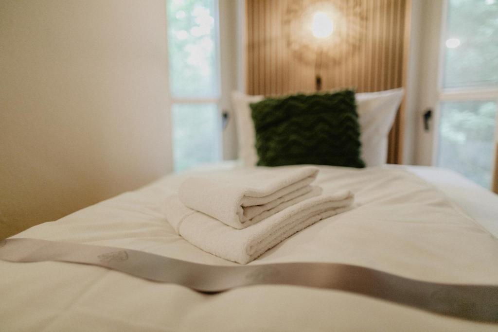Postel nebo postele na pokoji v ubytování Peak Hotel & Event