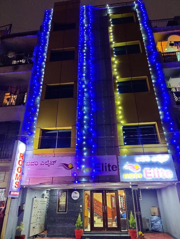 a hotel with blue lights on the side of it at Ivory Elite in Bangalore
