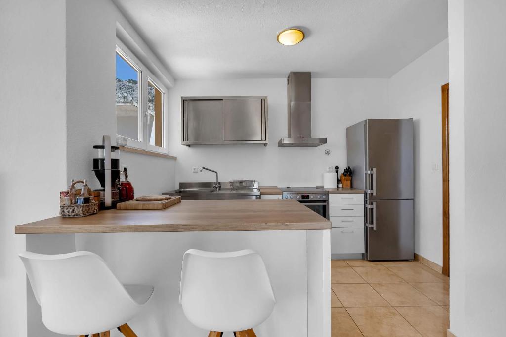 Kuchyň nebo kuchyňský kout v ubytování Apartments Marin