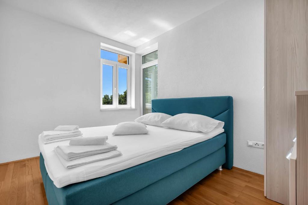 Postel nebo postele na pokoji v ubytování Apartments Marin