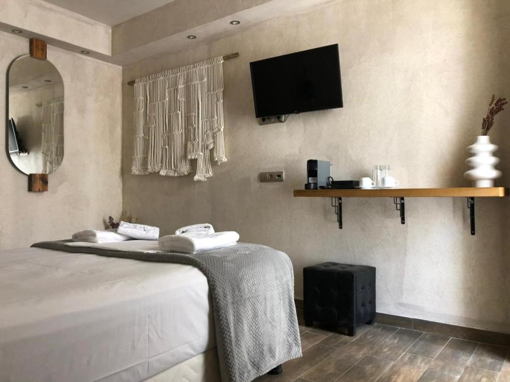Uma TV ou centro de entretenimento em GARDELLI RESORT