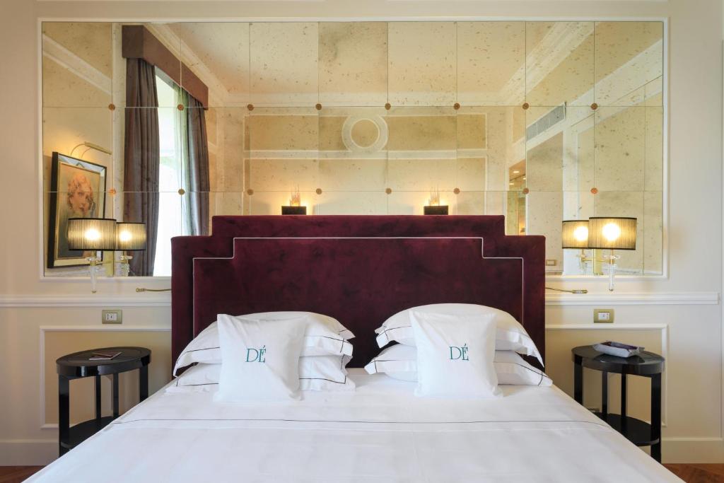 Postel nebo postele na pokoji v ubytování Grand Hotel Des Etrangers
