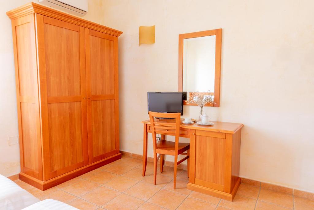 Televízia a/alebo spoločenská miestnosť v ubytovaní B&B Puerto Seguro