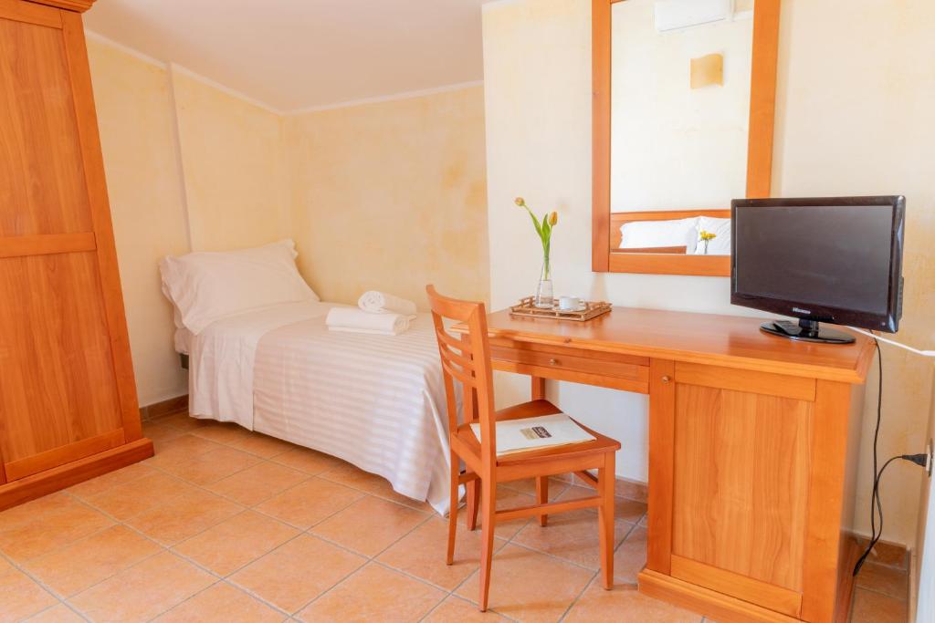Televízia a/alebo spoločenská miestnosť v ubytovaní B&B Puerto Seguro