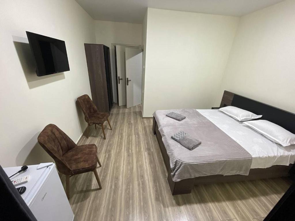 Rúm í herbergi á Hotel Estonia Two