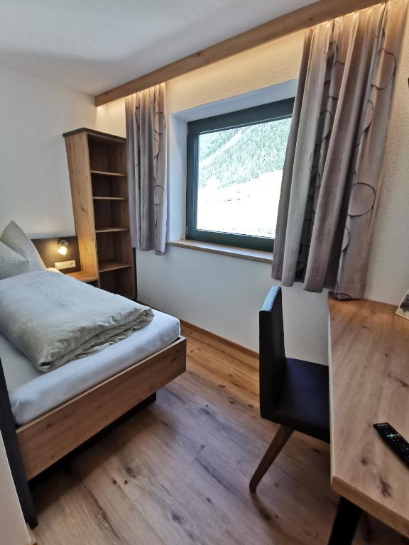 Posteľ alebo postele v izbe v ubytovaní Apart Grafspitz