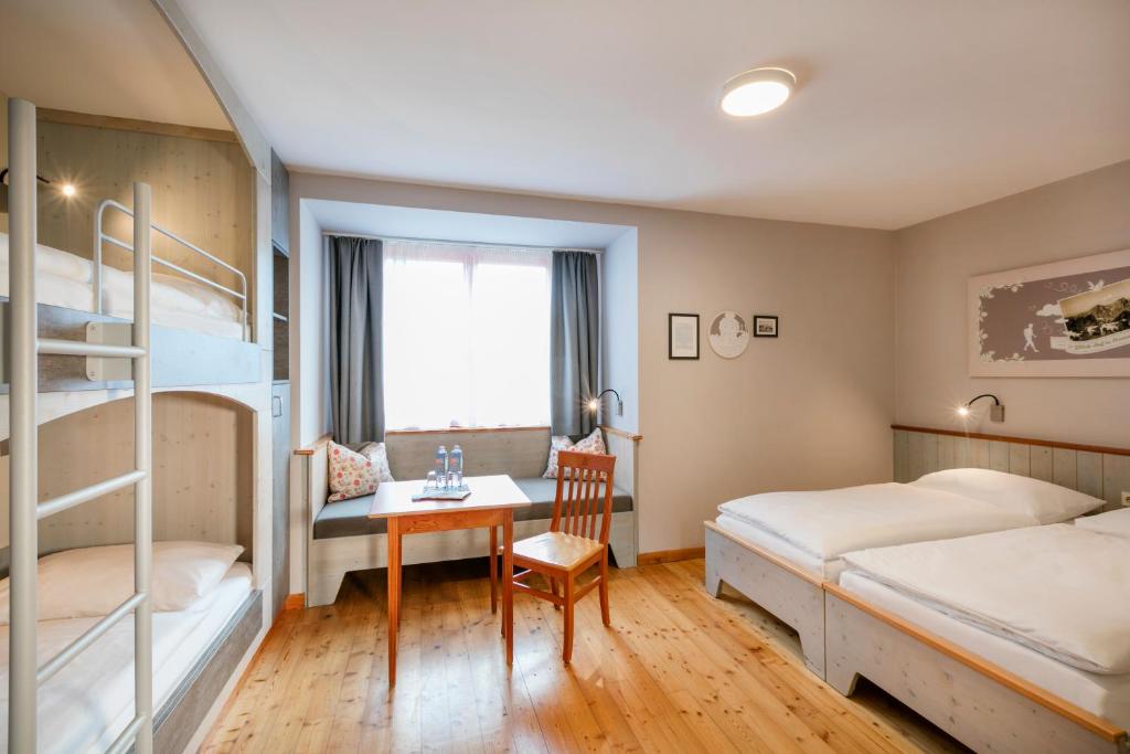 Postel nebo postele na pokoji v ubytování JUFA Hotel Eisenerzer Ramsau