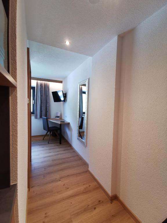 Televízia a/alebo spoločenská miestnosť v ubytovaní Apart Grafspitz