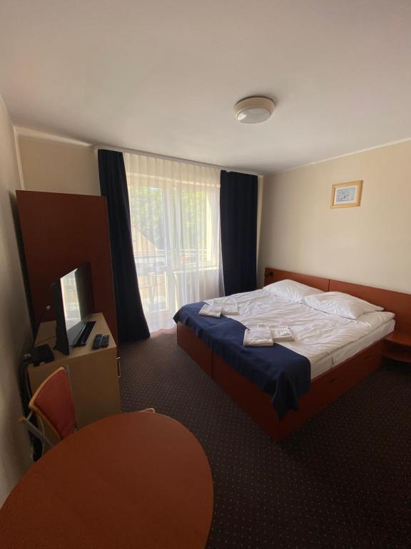 Postel nebo postele na pokoji v ubytování Villa Dominik