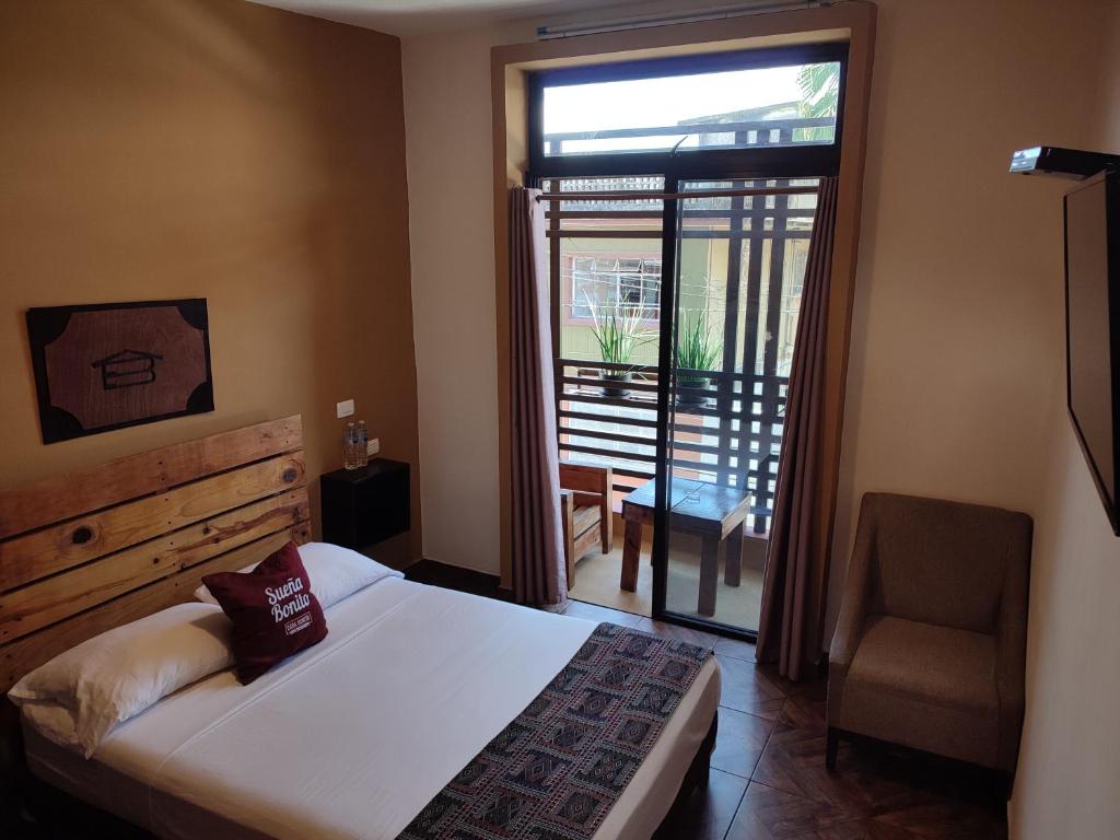 Postel nebo postele na pokoji v ubytování Casa Bonita Hotel y Hostal