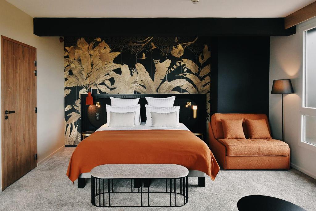 Postel nebo postele na pokoji v ubytování Golden Tulip Reims Bezannes