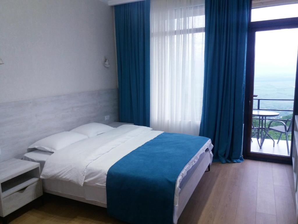 Postel nebo postele na pokoji v ubytování Hotel Martinichi