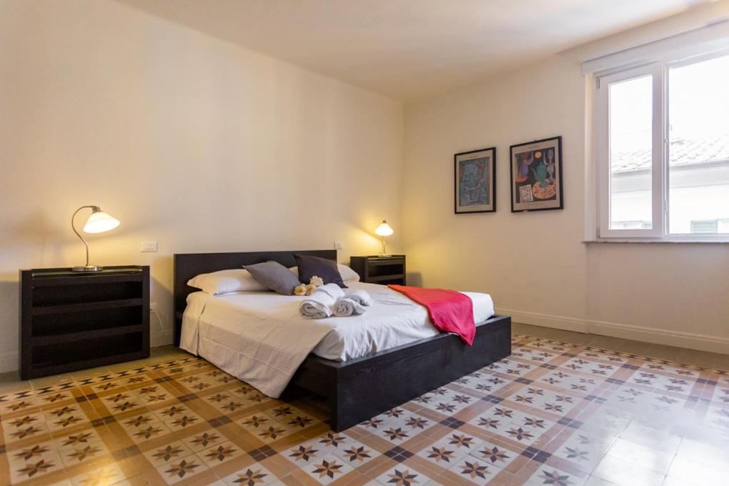 Ένα ή περισσότερα κρεβάτια σε δωμάτιο στο InnPisaRentals 2- Casa dei Cavalieri