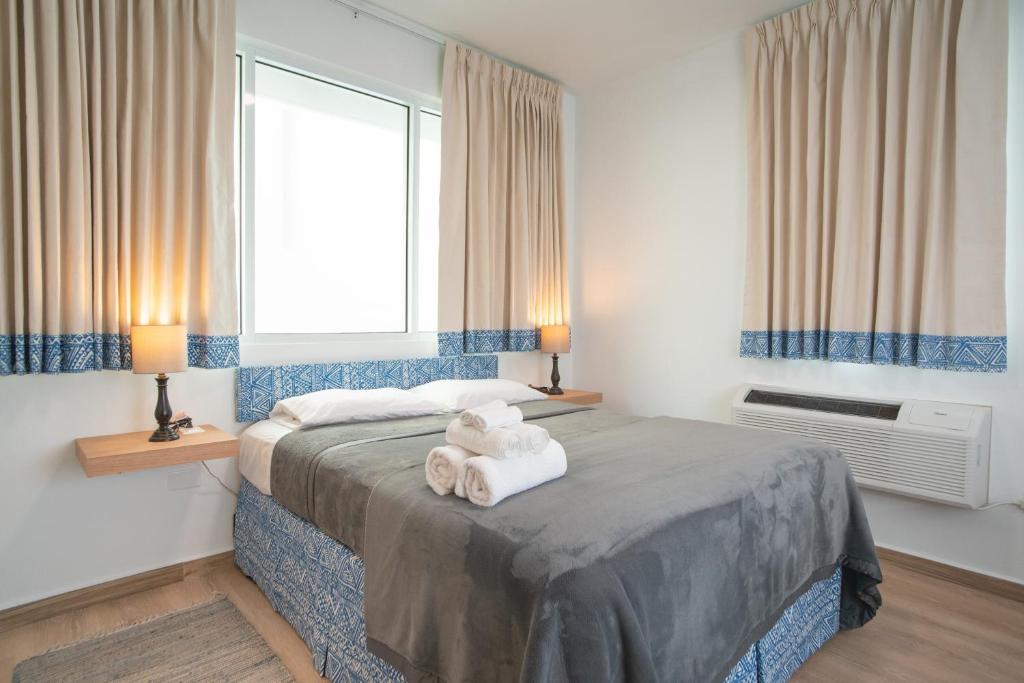 Postel nebo postele na pokoji v ubytování Casa Condado Hotel & Residences