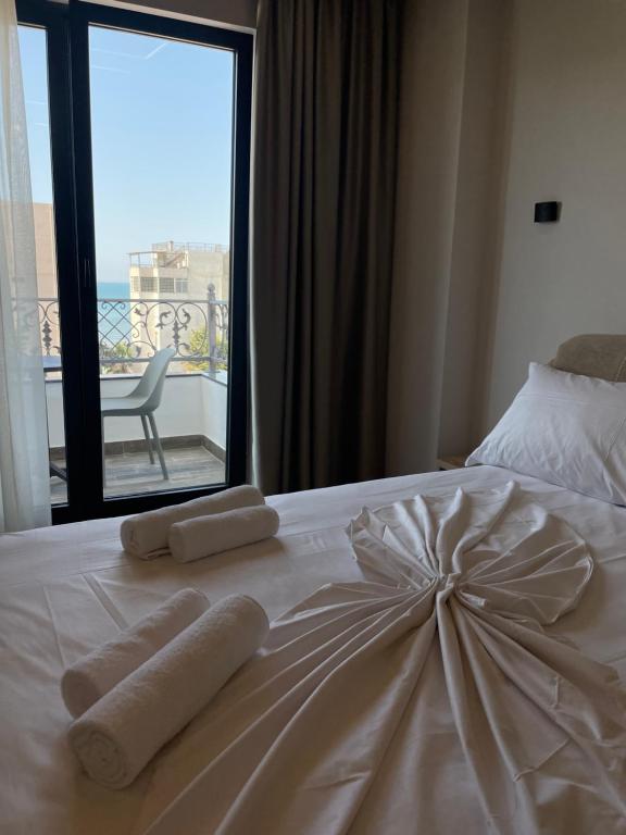Postel nebo postele na pokoji v ubytování Hotel Lubjana