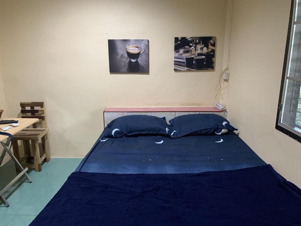 Postel nebo postele na pokoji v ubytování วังตาน้ำรีสอร์ท